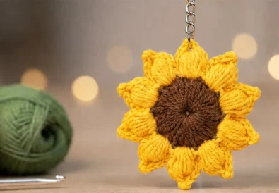easy crochet sunflower keychain pattern with puff stitch petals and brown center for beginners