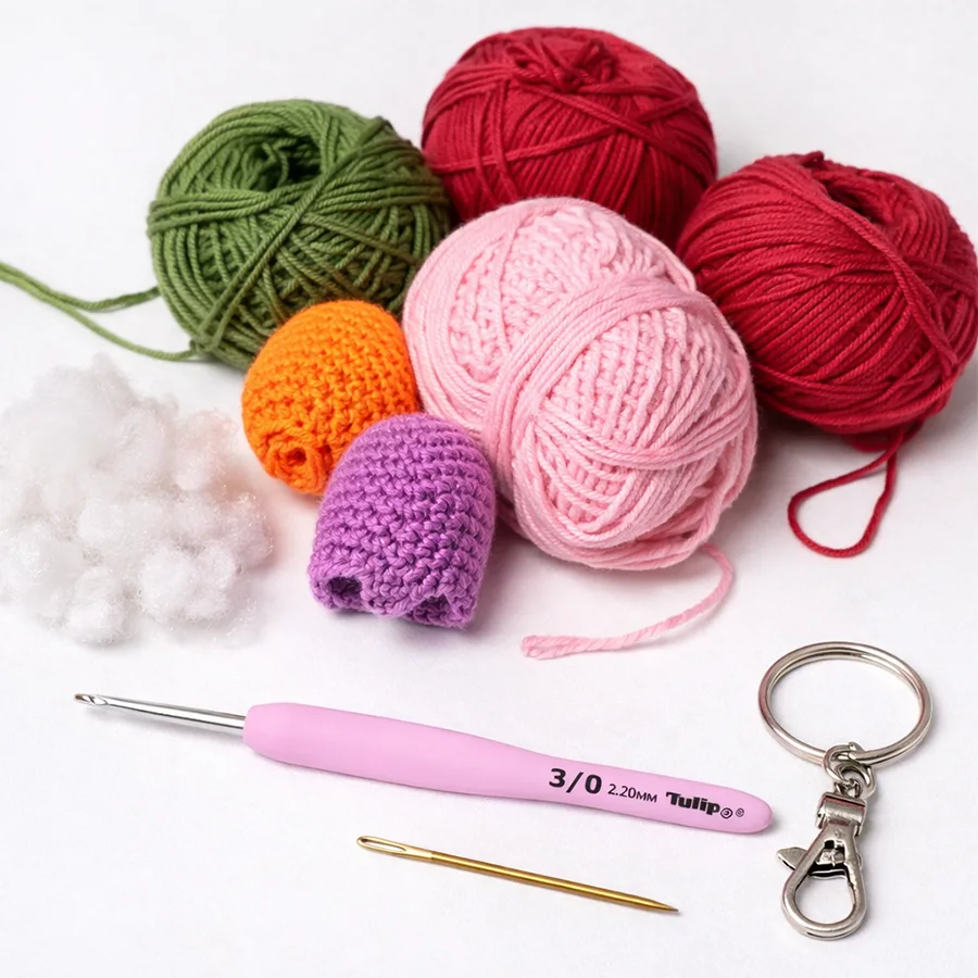 materials for crochet tulip keychain including cotton yarn crochet hook stuffing keychain ring and tapestry needle