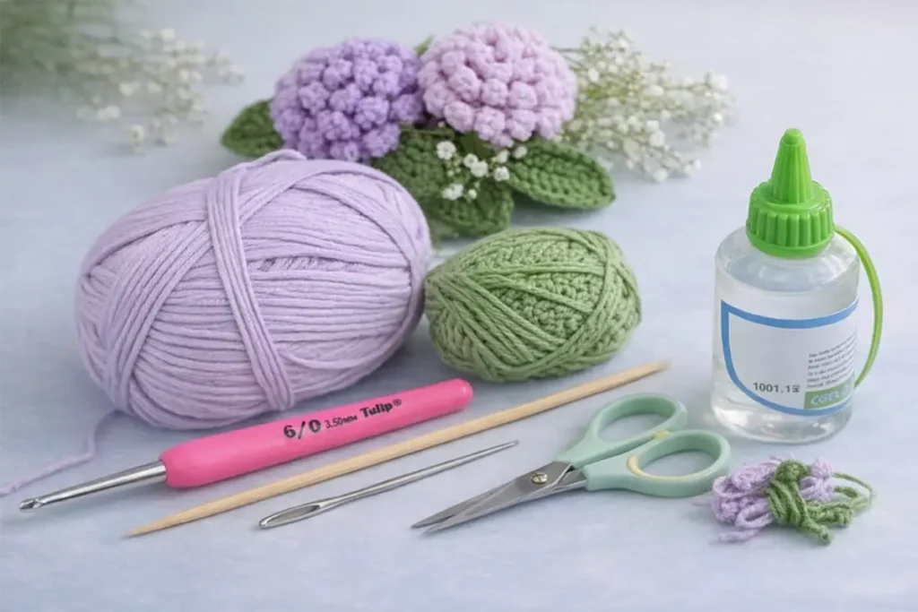 Materials for crochet chrysanthemum flower including yarn, 3.5 mm crochet hook, wooden skewer, scissors, needle and glue for beginner setup