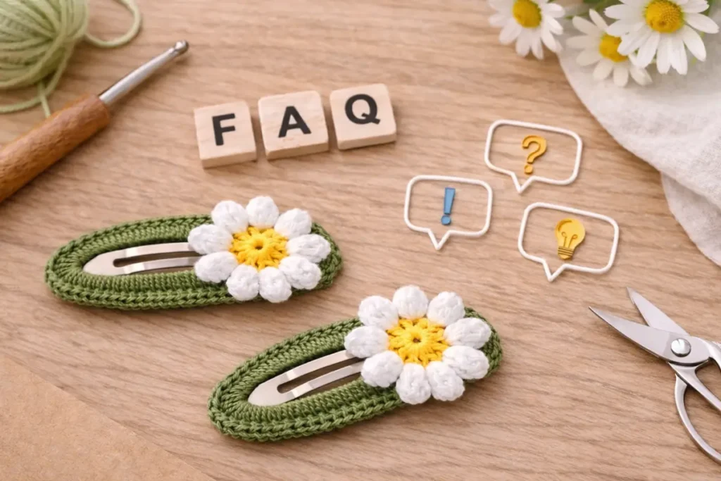 Crochet snap hair clip tutorial FAQ concept with daisy hair clips and crochet tools on wooden background