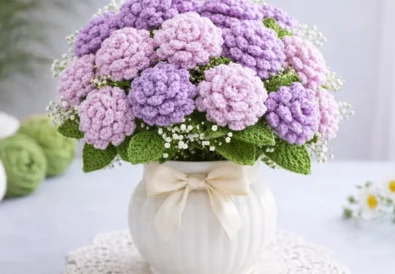 Easy crochet chrysanthemum flower in lilac color held in hand, perfect for home decor and handmade bouquet projects