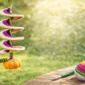 Easy crochet wind spinner with pumpkin motif hanging in a sunny garden, colorful spiral DIY crochet decoration for beginners