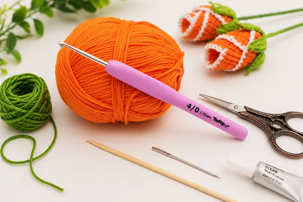 Cotton yarn and 2.5 mm crochet hook for an easy crochet rosebud flower tutorial with finished rosebuds in the background.