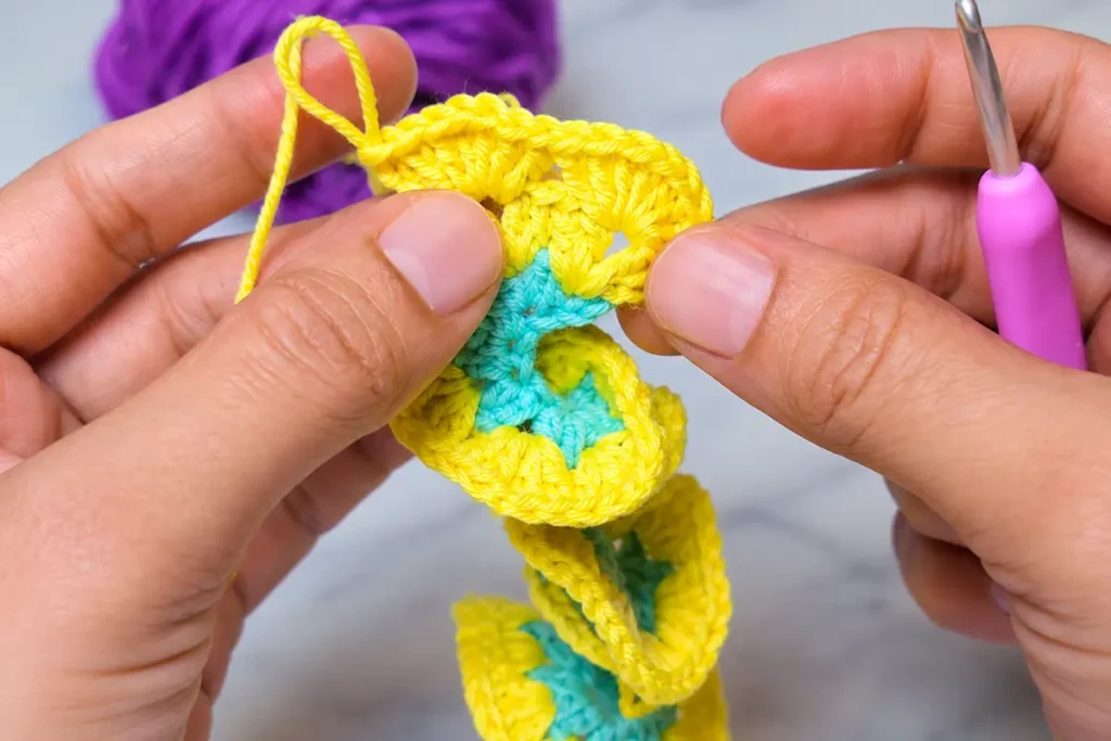 Step-by-step crochet wind spinner tutorial showing yellow and mint spiral stitches curling by themselves with a pink crochet hook.
