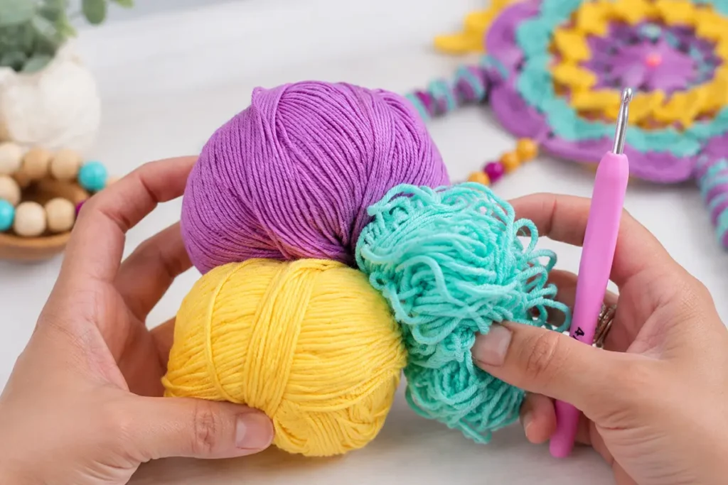 Colorful cotton yarn and a 2.5 mm crochet hook for making an easy crochet wind spinner pattern.