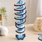 Easy crochet wind spinner with butterfly, beads, and blue and white spiral design for handmade porch decor