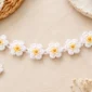 Crochet daisy bracelet with beaded flower centers