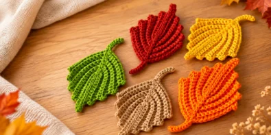 Crochet ribbed fall leaf pattern in orange, yellow, green, red, and beige