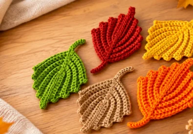 Crochet ribbed fall leaf pattern in orange, yellow, green, red, and beige